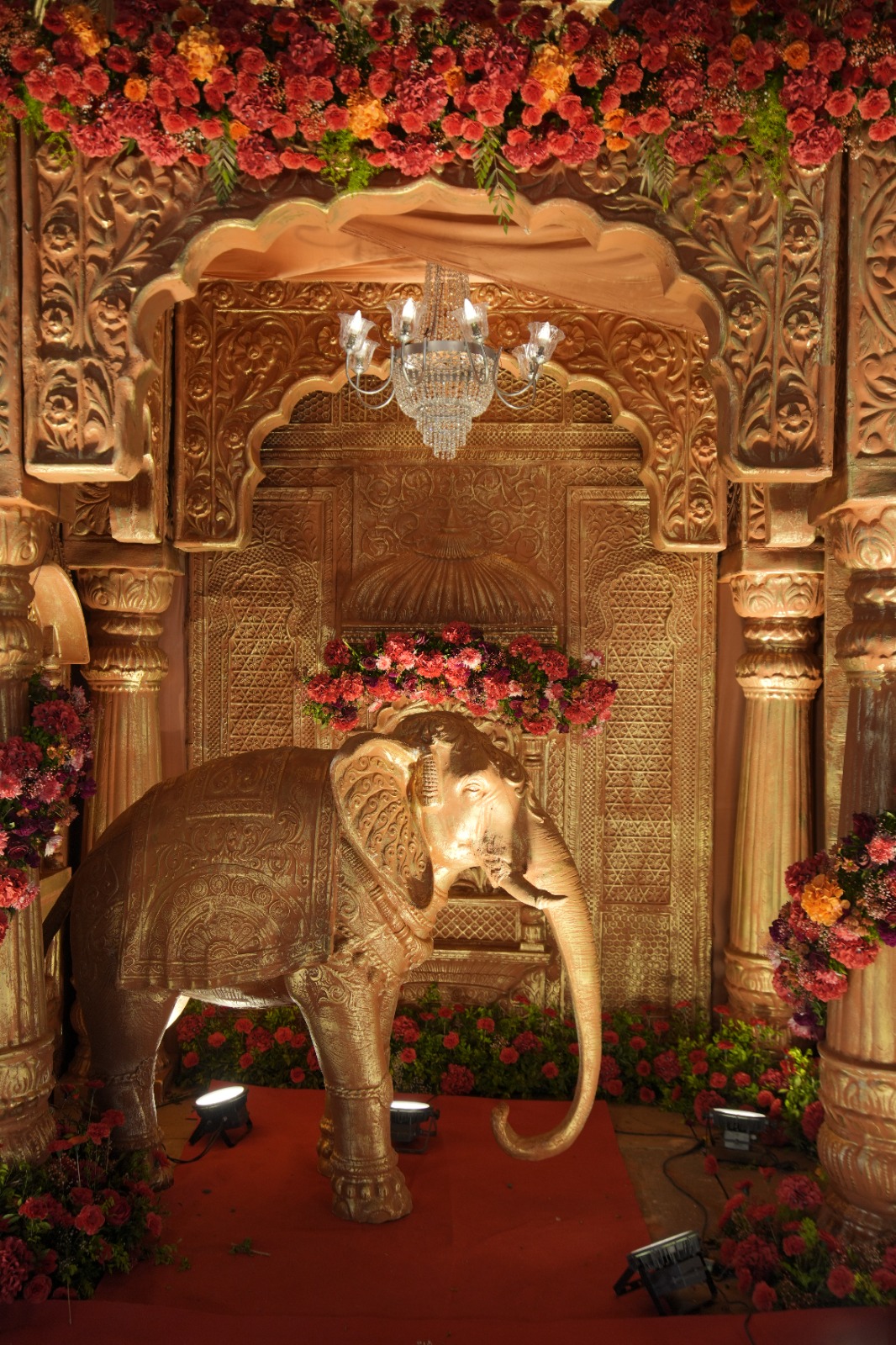 Golden elephant throne set with marigold arch